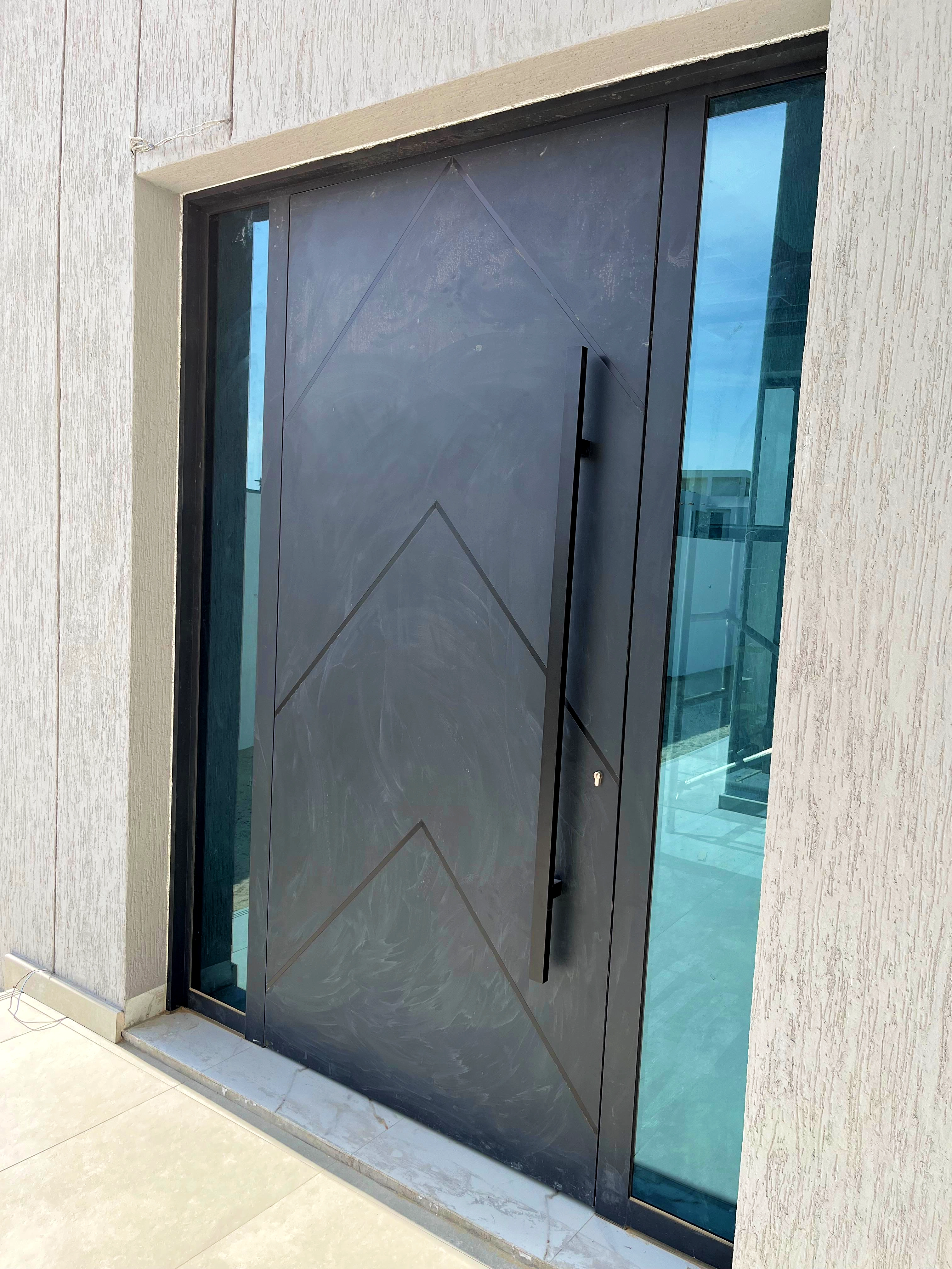 Large aluminium sliding windows in a modern living room.